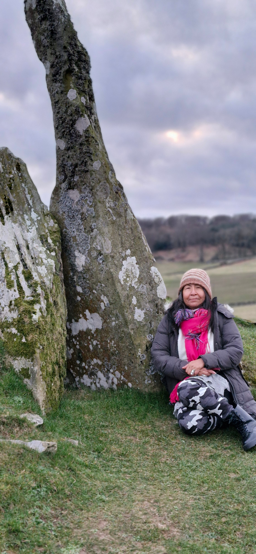 A wisdom keeper beside a moss-covered standing stone in Argyll
